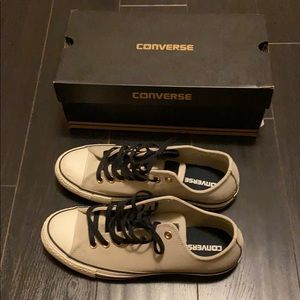 Beige Converse All Stars.